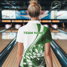 Load image into Gallery viewer, Back view of a women s white and green bowling quarter zip displaying sweeping curve artwork and a bowling ball crashing into pins graphic in a bowling center.