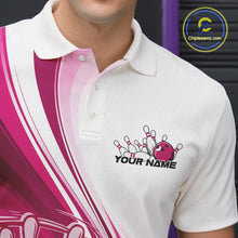 Load image into Gallery viewer, Close-up of the left chest area of a white and pink bowling polo shirt, featuring a dynamic curved bowling ball striking pins design.