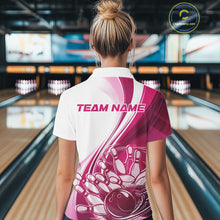 Load image into Gallery viewer, Back view of a female model in a bowling venue wearing a white and pink polo shirt, showcasing a dynamic curved bowling ball hitting pins design.