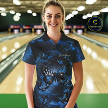 Load image into Gallery viewer, Female model at a bowling lane wearing a bowling polo shirt featuring a blue and black butterfly with a bowling ball body against a smoky background.