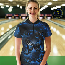 Load image into Gallery viewer, Female model at a bowling lane wearing a quarter-zip bowling shirt featuring a blue and black butterfly artwork with a bowling ball body.