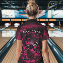 Load image into Gallery viewer, Back view of a female model in a bowling alley wearing a polo shirt showcasing a pink and black butterfly with a bowling ball body and smoky accents.