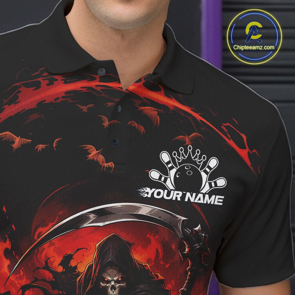 Close-up of the left chest on a black and red bowling polo shirt featuring a grim reaper commanding a blazing bowling ball crashing into scattered pins through swirling flames.
