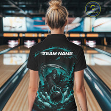 Load image into Gallery viewer, Back view of a female model wearing a black and cyan blue bowling polo shirt showcasing a grim reaper with a blazing bowling ball striking scattered pins amid swirling flames in a bowling lane.