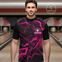 Load image into Gallery viewer, Male model wearing a black and pink quarter-zip in a bowling center featuring bold angular geometric artwork.