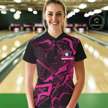 Load image into Gallery viewer, Female model wearing a black and pink quarter-zip in a bowling center with angular geometric artwork and cracked design elements.