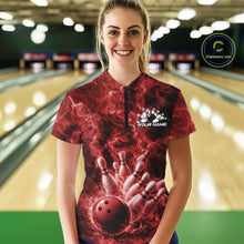 Load image into Gallery viewer, Female model in a bowling lane wearing a quarter-zip decorated with a red bowling ball and fiery bowling strike artwork.