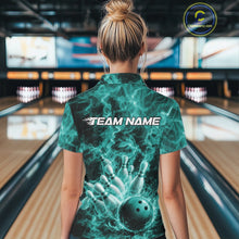 Load image into Gallery viewer, Back view of a womens bowling polo displaying a turquoise blue bowling ball striking pins against flames.