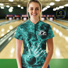 Load image into Gallery viewer, Female model wearing a bowling quarter-zip in a bowling center with turquoise blue bowling ball artwork and fiery accents.