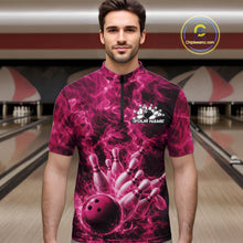 Load image into Gallery viewer, Male model wearing a bowling quarter-zip in a bowling lane with a pink bowling ball striking pins and fiery graphics.