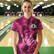 Load image into Gallery viewer, Female model wearing a bowling quarter-zip in a bowling lane featuring a pink bowling ball crashing through pins with blazing flame artwork.