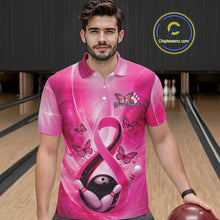 Load image into Gallery viewer, Male model wearing a bowling polo in a bowling lane displaying pink ribbon awareness artwork with butterflies and bowling elements.
