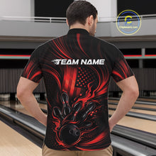 Load image into Gallery viewer, Front view of a male model in a bowling center wearing a black and red quarter-zip shirt featuring flaming bowling action artwork and patriotic styling.