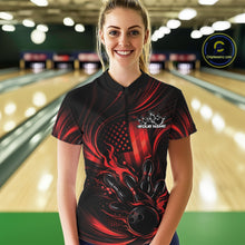 Load image into Gallery viewer, Female model at a bowling lane wearing a black and red bowling quarter-zip shirt with patriotic bowling strike graphics and flag-inspired accents.