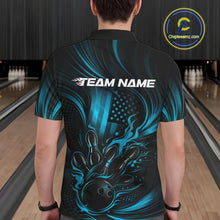 Load image into Gallery viewer, Back view of a male model in a bowling center wearing a black and turquoise blue polo featuring flaming bowling ball and pins artwork.