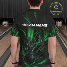 Load image into Gallery viewer, Back view of a male model in a bowling alley wearing a black and green polo featuring flaming bowling ball and American flag graphics.