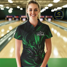 Load image into Gallery viewer, Female model at a bowling lane wearing a black and green bowling polo shirt with patriotic bowling strike artwork and distressed flag graphics.