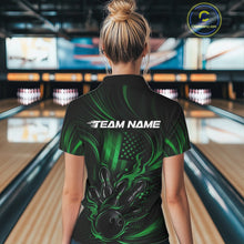 Load image into Gallery viewer, Back view of a female model in a bowling alley wearing a black and green quarter-zip shirt featuring a flaming bowling ball and patriotic pin design.