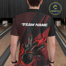 Load image into Gallery viewer, Back view of a male model in a bowling venue wearing a black and red polo shirt featuring a bowling strike scene with flame graphics.