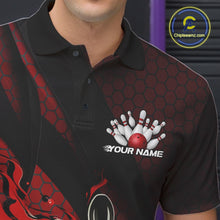 Load image into Gallery viewer, Close-up of the left chest on a black and red bowling polo shirt featuring a flaming bowling ball and pin artwork with diagonal stripe details.