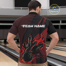 Load image into Gallery viewer, Front view of a male model in a bowling venue wearing a black and red quarter-zip shirt featuring a bowling strike scene with flame effects.