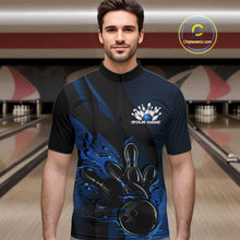 Load image into Gallery viewer, Male model at a bowling lane wearing a black and blue bowling quarter-zip shirt with fiery bowling strike artwork, hexagonal details, and diagonal striping.