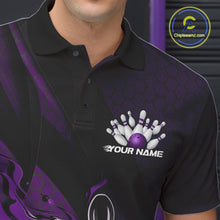 Load image into Gallery viewer, Close-up of the left chest area on a black and purple bowling polo shirt featuring a flaming bowling ball and pin design with diagonal stripes.
