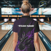 Load image into Gallery viewer, Female model at a bowling venue, back view of black and purple quarter zip shirt showing flames bowling ball hitting pins with hexagon and stripe design