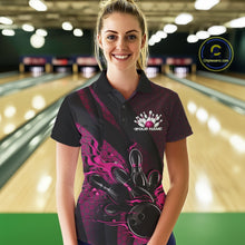 Load image into Gallery viewer, Female model at a bowling lane wearing a black and pink bowling polo shirt with bowling strike artwork, geometric graphics, and diagonal striping.