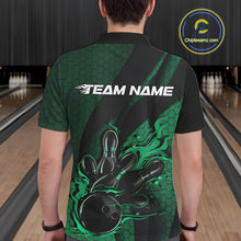 Load image into Gallery viewer, Back view of a male model in a bowling alley wearing a black and green polo shirt featuring a bowling strike design with hexagonal accents.