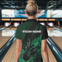 Load image into Gallery viewer, Back view of a female model in a bowling venue wearing a black and green polo shirt showcasing a bowling strike design with hexagonal accents.