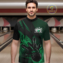 Load image into Gallery viewer, Male model wearing a black and green bowling quarter-zip shirt at a bowling lane with fiery bowling action artwork, hexagon motifs, and diagonal stripes.
