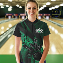 Load image into Gallery viewer, Female model in a bowling lane wearing black and green quarter zip shirt, front view featuring flaming bowling ball hitting pins with geometric stripe accents