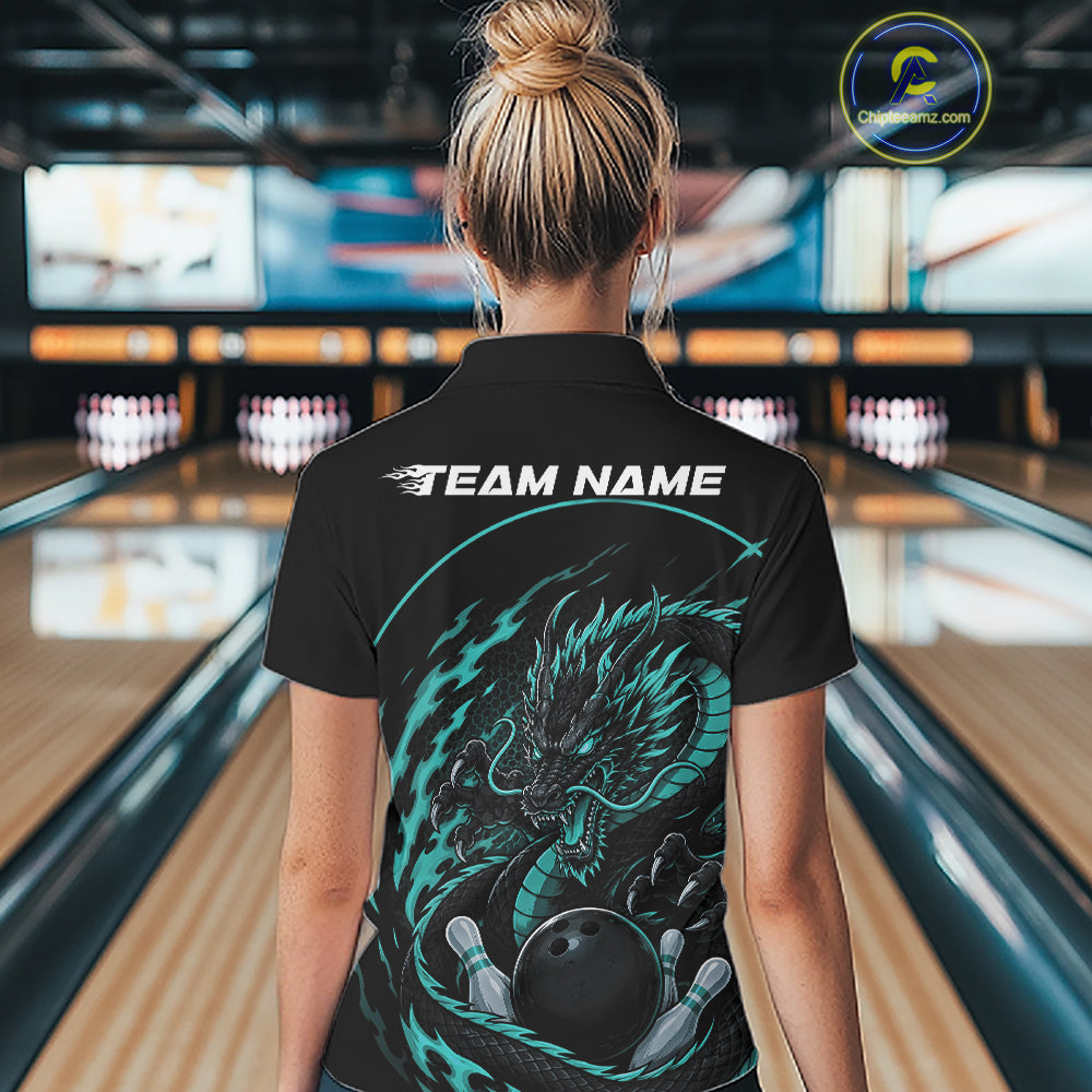 Back view of a female model in a bowling alley wearing a blue custom quarter-zip bowling shirt featuring an aggressive dragon with flames in a dynamic and energetic design.