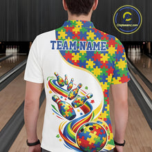 Load image into Gallery viewer, Male model at a bowling lane, back view of white polo shirt featuring autism-themed bowling strike artwork with vibrant puzzle accents