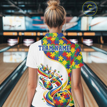 Load image into Gallery viewer, Female model in a bowling alley, back view of white polo shirt featuring autism puzzle bowling strike artwork with vibrant colors