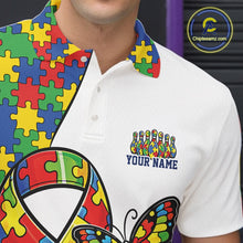 Load image into Gallery viewer, Close-up left chest detail of white bowling polo shirt featuring autism awareness ribbon puzzle emblem with butterfly and bowling strike graphics