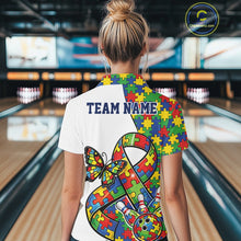 Load image into Gallery viewer, Back view of a female bowler wearing a white quarter-zip shirt, autism awareness ribbon design with puzzle pattern and bowling strike graphics.