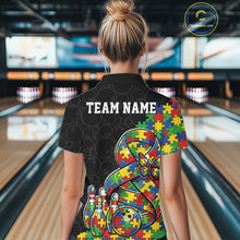 Load image into Gallery viewer, Female model at a bowling lane, back view wearing black polo shirt featuring autism ribbon puzzle design, butterfly detail, and bowling strike scene illustration