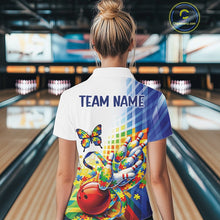 Load image into Gallery viewer, Female model at a bowling lane, back view of white and blue polo shirt with swirling puzzle ribbon and butterfly bowling motif