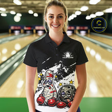 Load image into Gallery viewer, Female model at a bowling lane wearing a black and white polo shirt, playful boxing bowling strike artwork with bold contrast design.