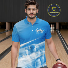 Load image into Gallery viewer, Male model front view at a bowling lane wearing a blue bowling polo shirt with bowling ball and pins over a pink geometric pattern.