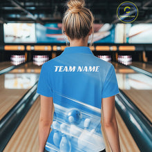 Load image into Gallery viewer, Back view of a female model at the bowling lane wearing a blue bowling polo shirt with bowling ball and pins geometric artwork.