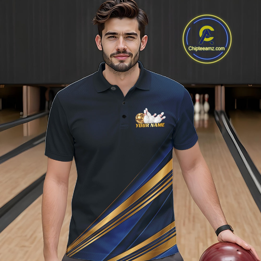 A man wearing a custom bowling polo shirt in a bowling alley. The shirt is navy blue with a diagonal gold and blue stripe pattern on the lower right side and a gold bowling pin graphic with 'YOUR NAME' text on the left chest.