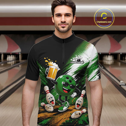 A man wearing a black short-sleeve quarter-zip bowling-themed graphic shirt with a green cartoon bowling ball character, bowling pins, beer, and white background brush strokes. 