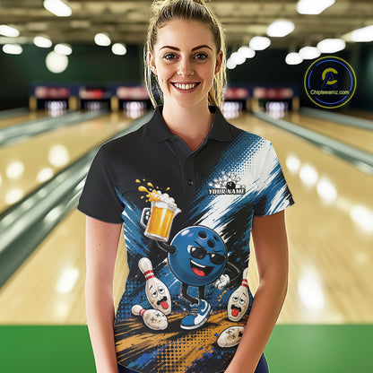 A woman stands in a bowling alley wearing a custom short-sleeve polo shirt with a colorful bowling-themed graphic print featuring a blue bowling ball character, bowling pins, and beer mugs. The background shows blurred bowling lanes.