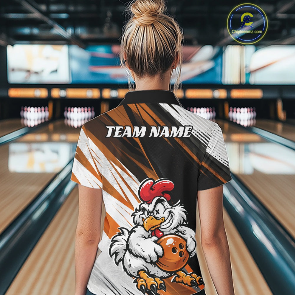 A woman viewed from behind wearing a custom bowling shirt in a bowling alley. The shirt features a black, red, and white graphic design with a cartoon chicken mascot holding a red bowling ball and the text 'TEAM NAME' printed across the upper back.