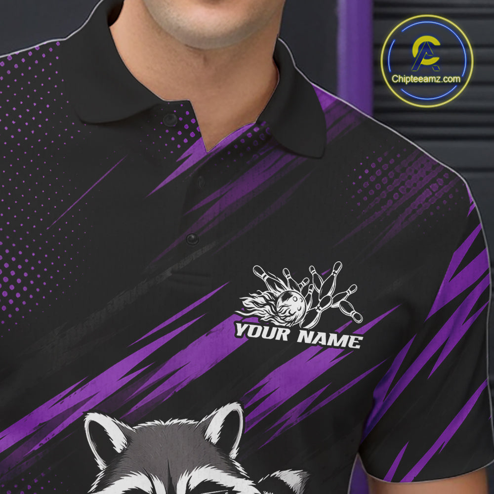 A close-up of a man wearing a black and purple custom polo shirt with a raccoon graphic and a white custom name graphic on the chest. 