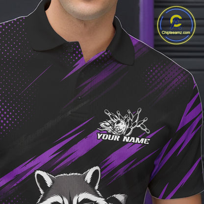 A close-up of a man wearing a black and purple custom polo shirt with a raccoon graphic and a white custom name graphic on the chest. 