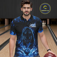 Load image into Gallery viewer, Front view of a male model in a bowling lane wearing a black polo shirt with glowing blue electric panther and dynamic bowling strike illustration.